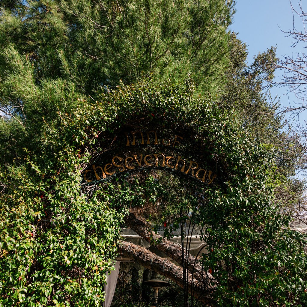 The Inn of the Seventh Ray entrance arch in the greenery