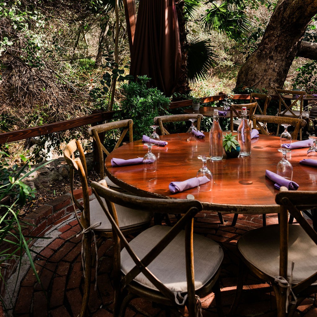 Round garden table set with lavender napkins