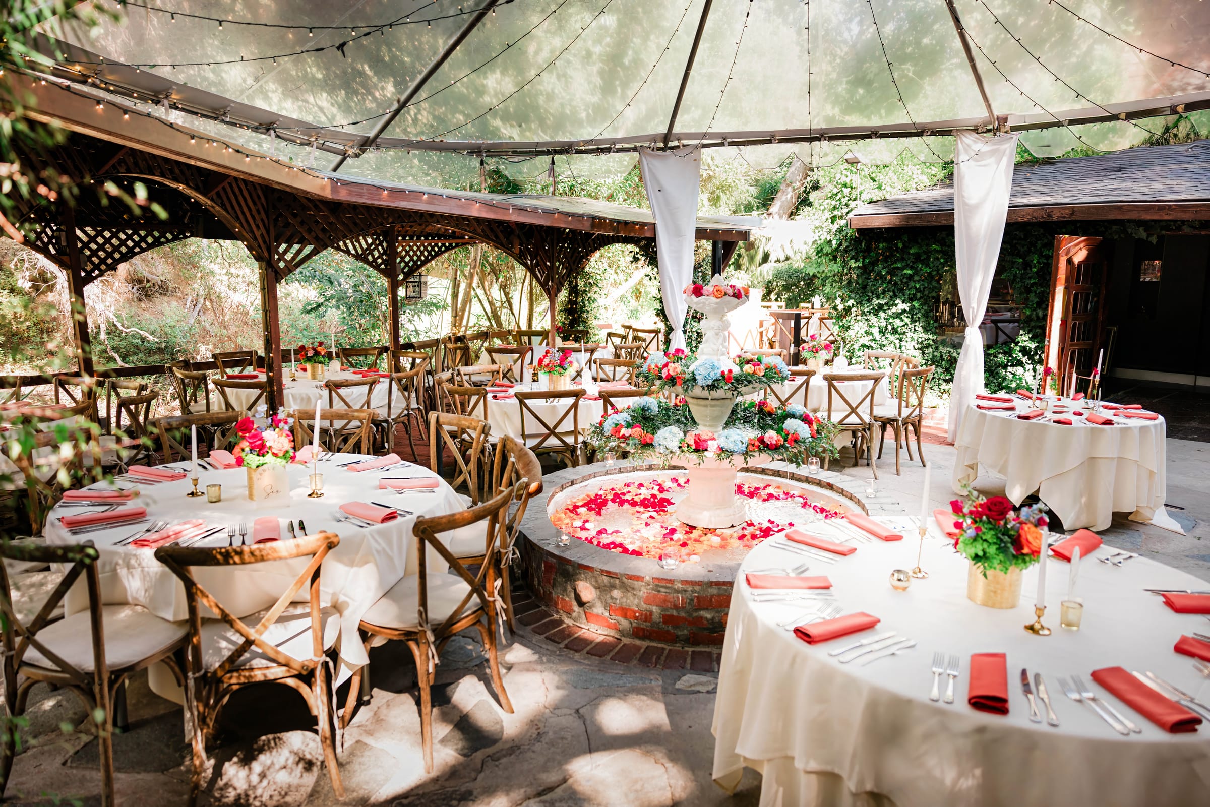 Garden reception around the antique stone fountain at Inn of the Seventh Ray